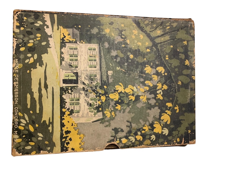 May include: Vintage box with a colorful illustration of a house and surrounding trees. The artwork features a house with multiple windows, surrounded by green foliage and yellow flowers. The text "HOME OF EMERSON, CONCORD, M" is visible on the side.