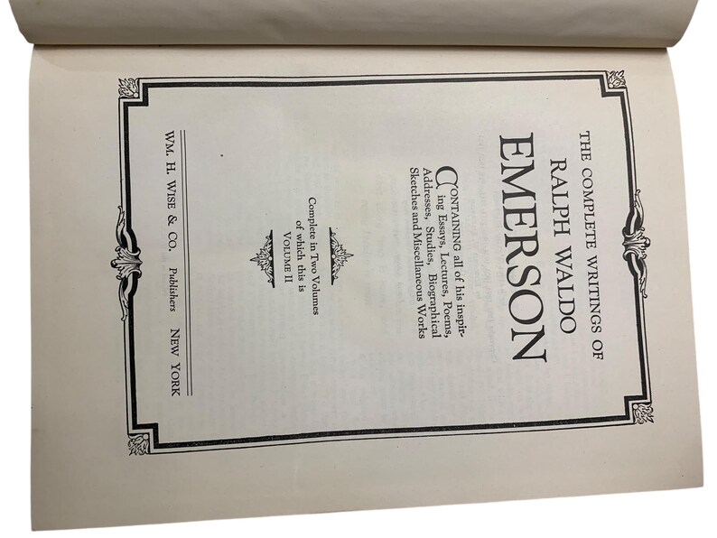 May include: Open book page featuring the title "The Complete Writings of Ralph Waldo Emerson." The text includes "Volume II" and the publisher's name, "WM. H. Wise & Co., Publishers, New York."