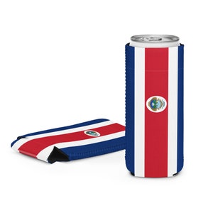May include: Two can coolers featuring the Costa Rican flag design. One is upright, holding a silver can, and the other is lying flat. The design includes a central red stripe, white stripes, and blue borders. The coolers are designed to keep drinks cool.