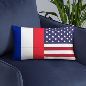 May include: A rectangular throw pillow featuring a split design. The left side displays the vertical blue, white, and red stripes of the French flag, while the right side shows the horizontal red and white stripes and blue field with white stars of the US flag.