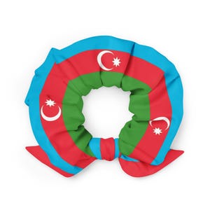 May include: A scrunchie displaying the flag of Azerbaijan. The design incorporates a crescent moon and eight-pointed star on a red backdrop, with green and blue stripes. This is a hair accessory.