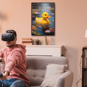 May include: A yellow rubber ducky floating in a blue pond with colorful leaves. The ducky is in a painting framed in black and hanging on a wall above a couch.