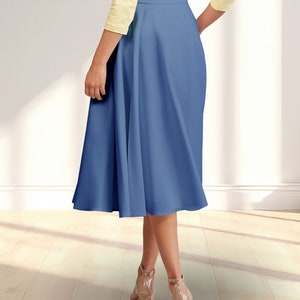 May include: A blue midi skirt with a flared silhouette. The skirt has a high waist and a smooth, matte finish.
