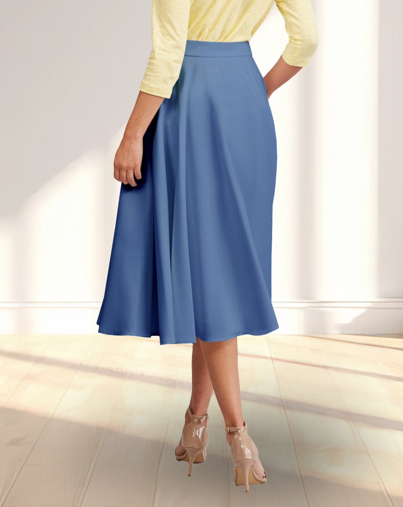 May include: A blue midi skirt with a flared silhouette. The skirt has a high waist and a smooth, matte finish.