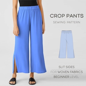 May include: Light blue crop pants with slit sides, shown on a person. The pants have an elastic waistband. The image includes the text "CROP PANTS SEWING PATTERN" and "SLIT SIDES FOR WOVEN FABRICS BEGINNER LEVEL".