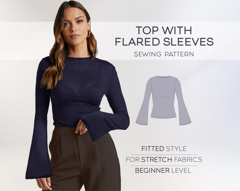 May include: A sewing pattern for a fitted top with flared sleeves. The pattern is for stretch fabrics and is beginner level. The image shows a model wearing a navy blue top with flared sleeves.