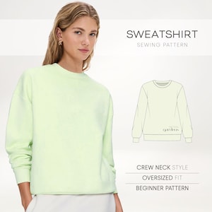 May include: A light green crew neck sweatshirt. The image also shows a sewing pattern for a sweatshirt, with text that reads "SWEATSHIRT SEWING PATTERN". The pattern is described as "CREW NECK STYLE", "OVERSIZED FIT", and "BEGINNER PATTERN".