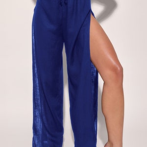 May include: Royal blue wide-leg pants with a drawstring waist and high slits on the sides.