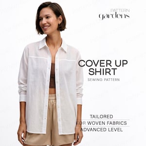 May include: A white long-sleeved button-down shirt with a collar, featuring text that reads Pattern Gardens COVER UP SHIRT SEWING PATTERN TAILORED FOR WOVEN FABRICS ADVANCED LEVEL. The shirt is worn over a brown top and tan shorts.
