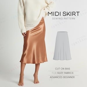 Può includere: Immagine di un modello di cucito per gonna midi. La gonna è in raso color rame. Il testo sull'immagine dice "Midi Skirt Sewing Pattern", "Cut on Bias", "For Silky Fabrics" e "Advanced Beginner".