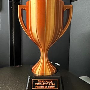 Trofeo con placa personalizable