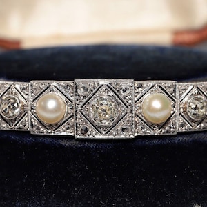 Circa 1920s Art Deco Platinum Natural Old Cut Diamond And Pearl Bracelet