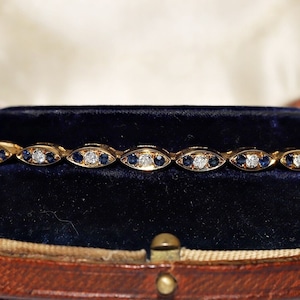 Vintage Circa 1980s 18k Gold Natural Diamond And Sapphire Decorated Bracelet
