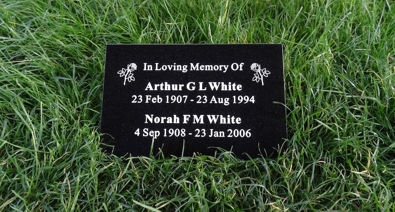May include: Black granite memorial plaque with white lettering. The inscription reads "In Loving Memory Of Arthur G L White 23 Feb 1907 - 23 Aug 1994 Norah F M White 4 Sep 1908 - 23 Jan 2006".