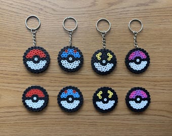 Handmade Perler pokemon-inspired pokeball keychains and magnets