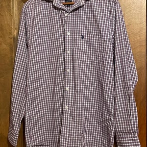May include: A long-sleeve button-down shirt featuring a plaid pattern in shades of maroon, white, and navy blue. The shirt includes a pointed collar, a front button placket, and a small navy blue embroidered logo on the left chest pocket area.