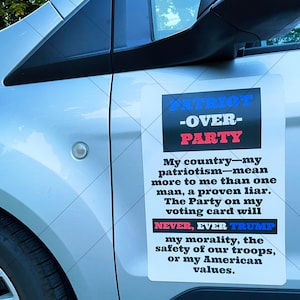 May include: A white car with a black and red magnet that reads "PATRIOT -OVER- PARTY". The magnet also includes the text "My country-my patriotism-mean more to me than one man, a proven liar. The Party on my voting card will NEVER, EVER TRUMP my morality, the safety of our troops, or my American values." The magnet is 12 inches by 18 inches.