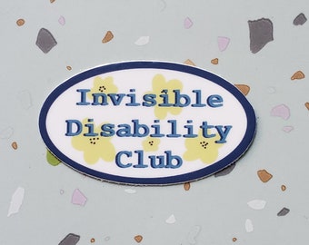 May include: An oval sticker with the words "Invisible Disability Club" in blue, surrounded by a navy blue border. Yellow flower graphics are interspersed around the text. The sticker is on a light blue background with colorful flecks.