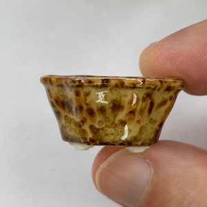 May include: A rustic wooden sign with the text "Welcome to our home" in white lettering. The sign features a distressed finish and a simple, inviting design, perfect for entryway decor.