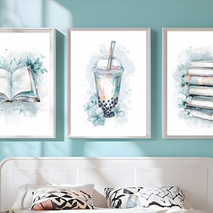 May include: Three framed watercolor prints. The left print shows an open book with teal accents. The center print depicts a bubble tea drink. The right print features a stack of books. All prints have a white frame and are decorated with teal floral accents.