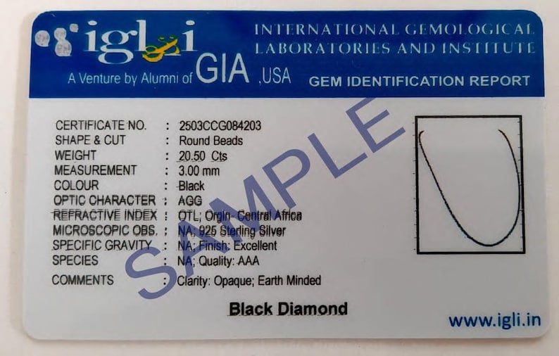 May include: A gem identification report from IGLI USA, featuring details of a black diamond. The card includes the certificate number, shape, weight (20.50 Cts), and measurement (3.00 mm). The text "Black Diamond" is visible.