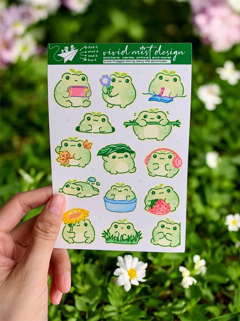 At the top of the sheet is a green header card branded with playful line art and text, introducing the sticker collection. Below it, multiple individual frog stickers are arranged neatly across a light lavender background with faint polka dots. Each frog has a slightly different pose and activity, making the sheet feel lively and story-driven.