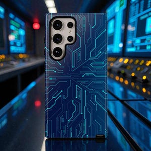 May include: A navy blue phone case featuring a circuit board design in teal. The case has a rectangular shape with rounded corners and a camera cutout. The background is a blurred image of a control room.