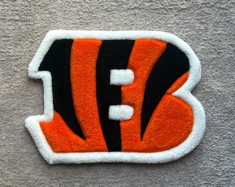 Custom Tufted Football Logo Rug | Handmade Sports Wall Art | Orange & Black Statement Rug