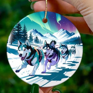 Alaska Christmas Ornament Sled Dog Team Under Northern Lights Spirit of Adventure Arctic Winter Landscape Holiday Nature Keepsake