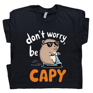 Funny Capybara Scooter Shirt, Don&#39;t Worry Be Capy Tee, Cute Animal Lover Gift, Whimsical Capybara T-Shirt, Chill Vibes Outfit