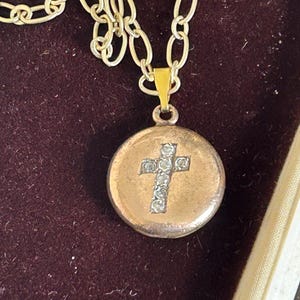 Antique circa 1900 gold filled Victorian tiny locket with paste stones in shape of cross on gold tone chain necklace