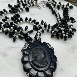 Vintage scalloped edge black large celluloid cameo possibly mounted to Bakelite on acrylic black beads and pearls upcycled necklace