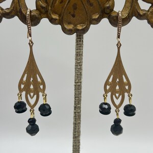 Custom made vintage  earrings with art deco style decorative brass dangle and faceted black glass beads, 2.5”