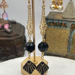 Custom made vintage earrings with art deco style decorative brass dangle and faceted black glass beads, 4”