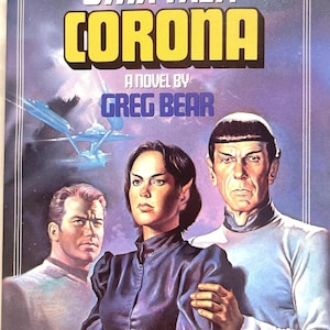 May include: A book cover for the Star Trek novel "Corona" by Greg Bear. The cover features a colorful illustration of three characters from the Star Trek universe, including Captain Kirk, Spock, and a female character.