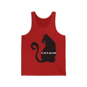 May include: Red sleeveless tank top with a black silhouette of a cat sitting with its tail curled around its body. The text "Cat Parent" is printed in white below the cat.