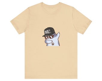 May include: A light beige t-shirt with a cartoon illustration of a cat wearing sunglasses and a black baseball cap with the word "SWAG" on it. The cat is doing the dab dance.