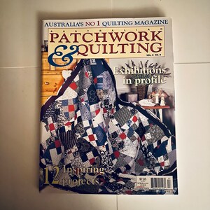 May include: A magazine cover for "Australian Patchwork & Quilting" magazine, volume 8, number 8. The cover features a colorful patchwork quilt with red, blue, and white squares. The text "Exhibitions in profile" is printed in white on a black background. The text "12 Inspiring Projects" is printed in gold on a black background. The price is $7.95.