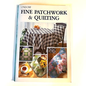 May include: A book titled "ONDORI FINE PATCHWORK & QUILTING" featuring images of patchwork quilts and tablecloths. The book cover shows a black and white checkered tablecloth, a green and white patchwork quilt, a blue and pink patchwork quilt, and a green and yellow patchwork quilt.
