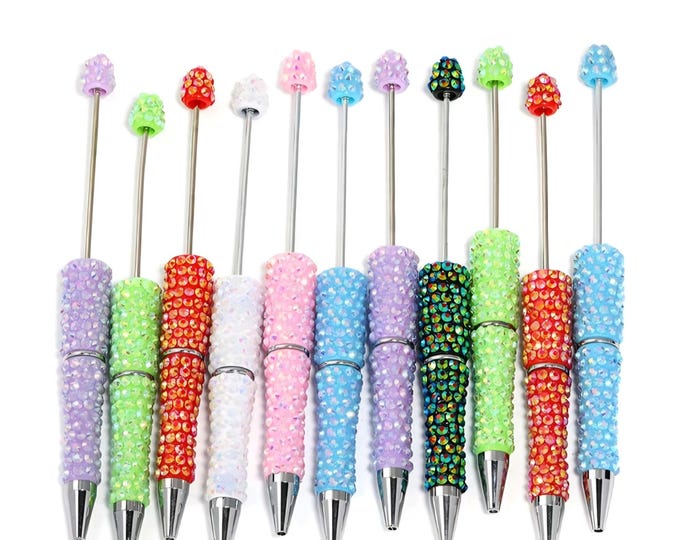Rhinestone  pens in a variety of colors. Includes  black ink refills, storage bags, beadable pens for beads, Doorables. Sold individually
