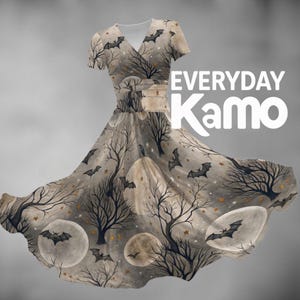 May include: A short-sleeved dress with a V-neckline featuring a beige and gray pattern of bare trees, full moons, stars, and flying bats. The text "EVERYDAY Kamo" is printed in white on the right side of the dress against the patterned fabric.