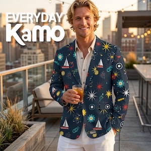May include: A dark blue blazer featuring a repeating pattern of white sailboats, yellow and red starbursts, and atomic symbols. The blazer is worn over a light beige button-down shirt. The text "EVERYDAY Kamo" is visible in the upper left corner.