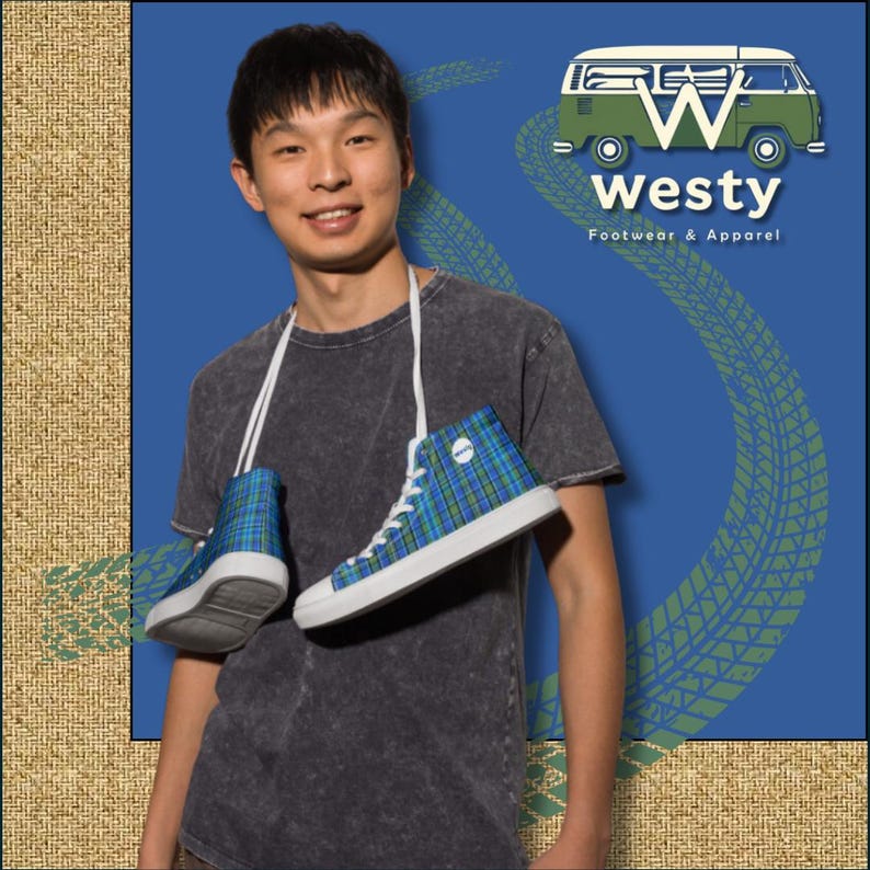 May include: A man wearing a blue and green plaid high-top sneaker with a white sole. The sneaker is hanging around his neck by the laces. The man is wearing a dark gray t-shirt. The background is a blue and green pattern of tire tracks. The text "Westy Footwear & Apparel" is visible in the top right corner of the image.