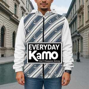 May include: A white zip-up hoodie with a navy blue and white nautical pattern featuring anchors and rope designs. The hoodie has a black zipper and the text "EVERYDAY Kamo" in a black and white rectangle. The text "Don't Disappear, Belong" is below the logo.