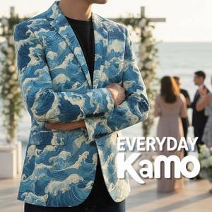 May include: A blue blazer with a wave pattern, featuring shades of blue and white. The jacket has a classic design with a two-button closure and is worn over a black shirt. The text "EVERYDAY Kamo" is visible on the lower right.