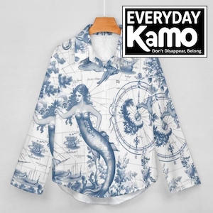 May include: A long-sleeved button-down shirt with a blue and white nautical-themed print. The design features a mermaid, compass rose, ships, and map elements. The shirt is hanging on a wooden hanger.