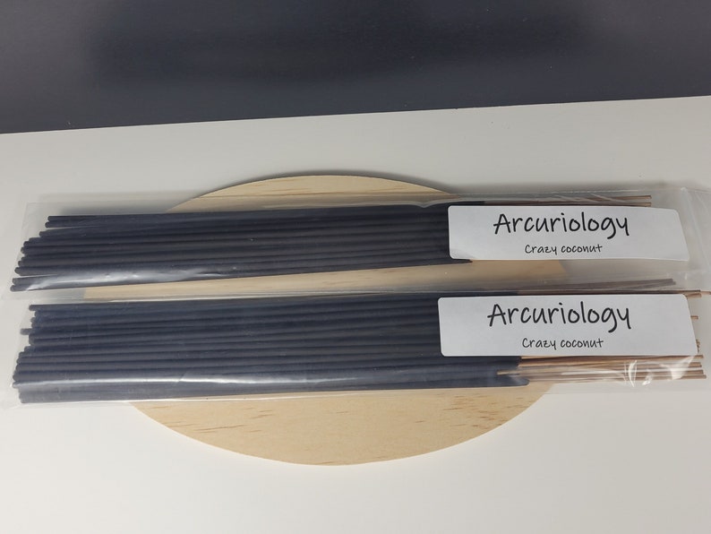 May include: Two packs of black incense sticks with white labels that read "Arcuriology" and "Srazy coconut".