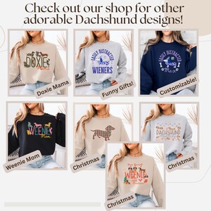May include: A collage of sweatshirts with Dachshund designs. The sweatshirts are in various colors, including beige, gray, and navy blue. Text includes "Doxie Mama", "Wieners", "Weenie Mom", and "Christmas". The image also includes the text "Check out our shop for other adorable Dachshund designs!"