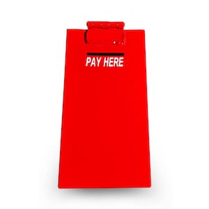 May include: A red metal donation box with a slot on the top and the words "PAY HERE" printed in white.