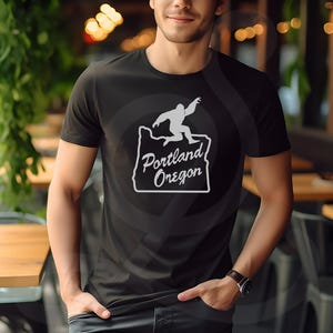 Sasquatch Meme of Iconic Welcome to Portland Oregon Sign, PNW T-shirt - Unisex Softstyle T-shirt. Rep the PNW with this stylish outerwear